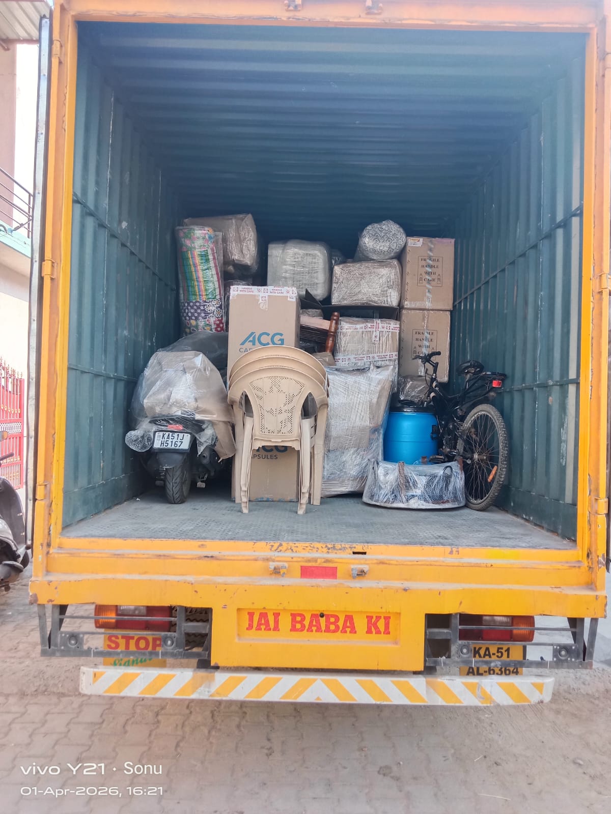 Moving team loading boxes into transport vehicle
